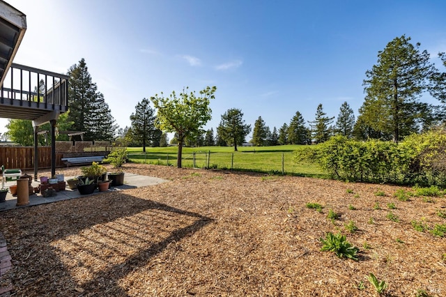 view of yard featuring fence and a patio area