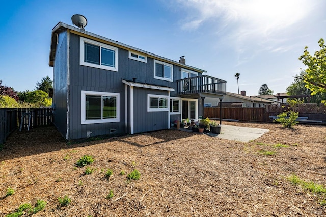 back of house featuring a fenced backyard and a patio area