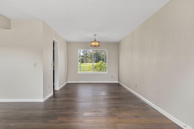 unfurnished dining area with baseboards, a chandelier, and dark wood-type flooring
