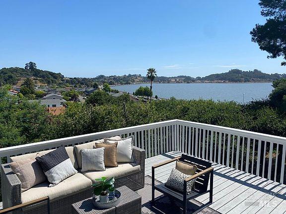 15 Main Dr, San Rafael, CA 94901 - wooden deck featuring an outdoor living space and a water view