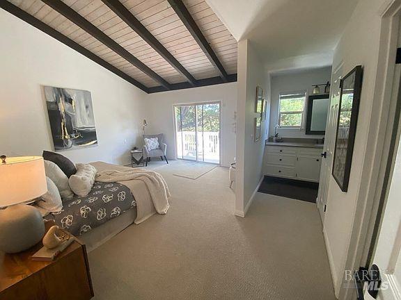15 Main Dr, San Rafael, CA 94901 - bedroom with carpet floors, vaulted ceiling with beams, baseboards, wooden ceiling, and access to outside