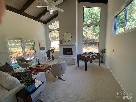 15 Main Dr, San Rafael, CA 94901 - living room featuring wood ceiling, beamed ceiling, high vaulted ceiling, and plenty of natural light