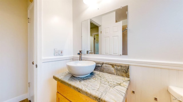 bathroom with wainscoting and vanity