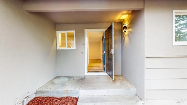 property entrance featuring stucco siding