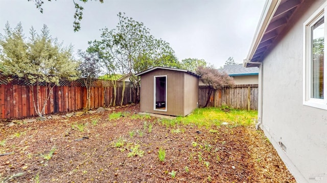 view of shed with a fenced backyard