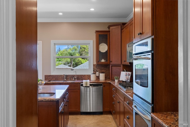 190 Franklin St, Napa, CA 94558 - kitchen with stainless steel appliances, brown cabinetry, dark stone countertops, a sink, and glass insert cabinets