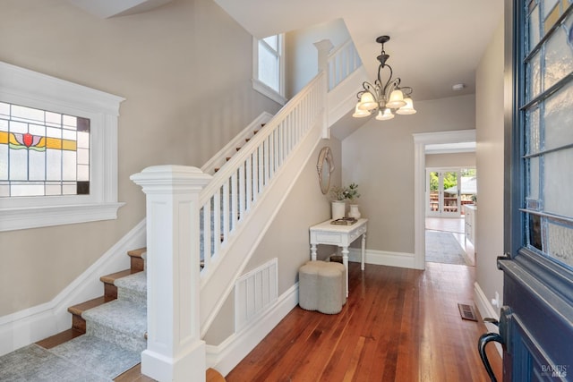 190 Franklin St, Napa, CA 94558 - stairway with a chandelier, hardwood / wood-style flooring, and baseboards