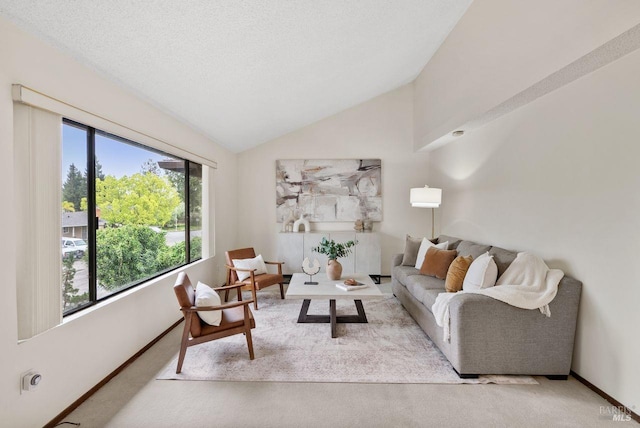 living room with carpet floors, baseboards, and lofted ceiling