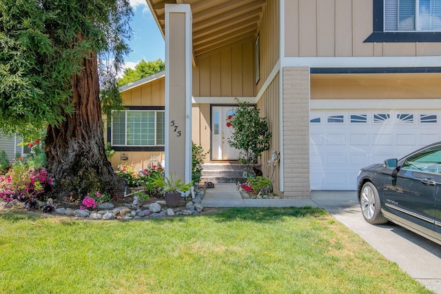 view of exterior entry featuring a lawn, board and batten siding, and brick siding