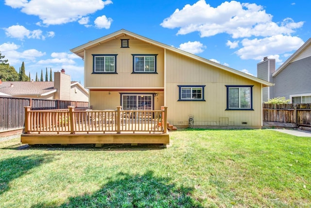 back of property featuring a lawn, a fenced backyard, and a wooden deck