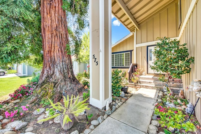 doorway to property featuring board and batten siding