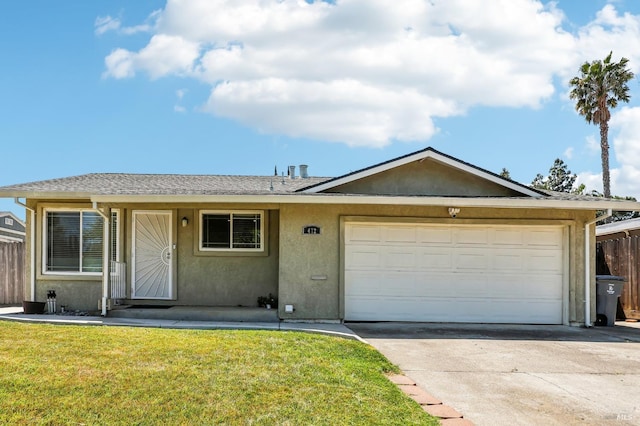 single story home with a front yard, fence, concrete driveway, an attached garage, and stucco siding