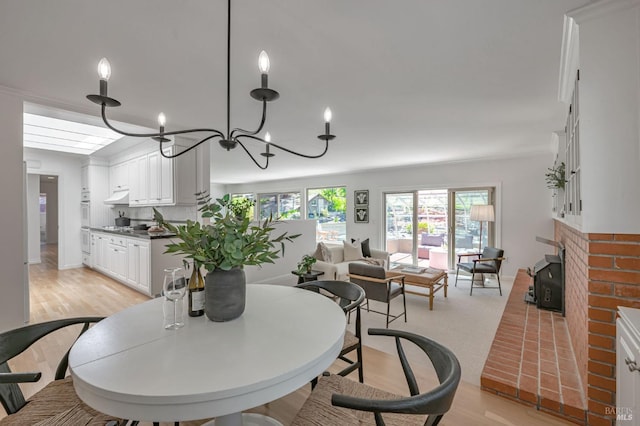 dining room with an inviting chandelier and light wood finished floors
