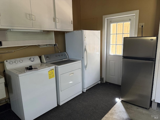 washroom with cabinet space and washing machine and clothes dryer