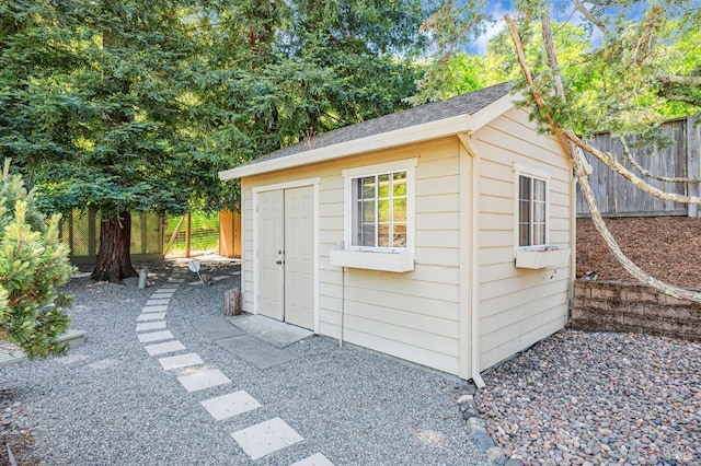 view of shed with fence