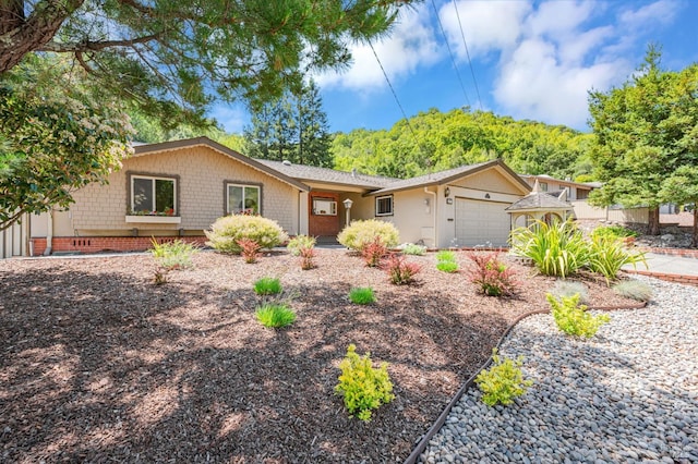 ranch-style house featuring an attached garage