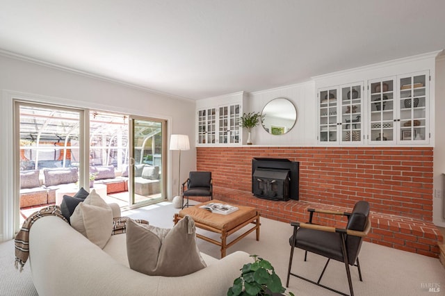 living area featuring carpet flooring, ornamental molding, and a wood stove