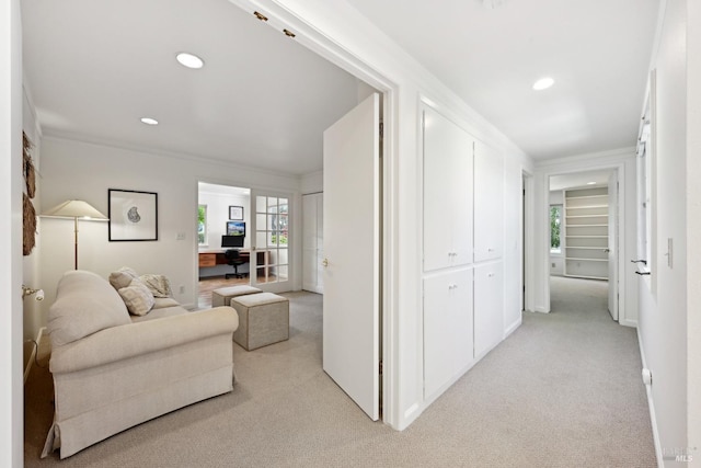 hallway featuring light colored carpet, recessed lighting, and crown molding