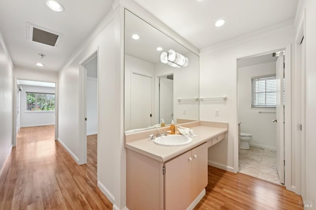 bathroom with toilet, visible vents, ornamental molding, and recessed lighting