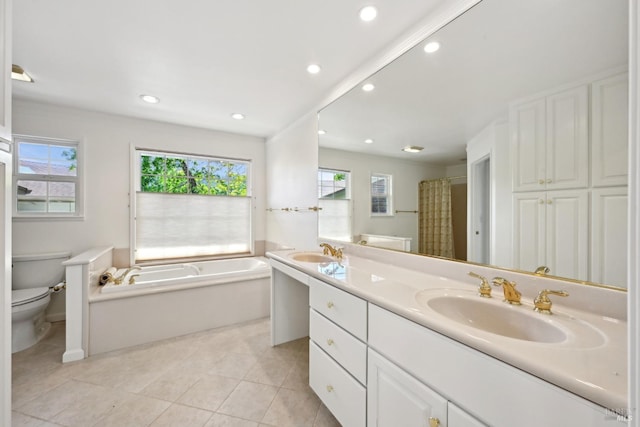 full bath with toilet, a healthy amount of sunlight, a sink, and a garden tub