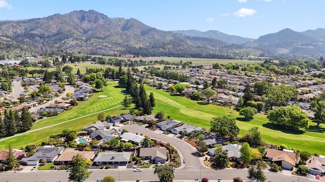 aerial view featuring a residential view, a mountain view, and view of golf course