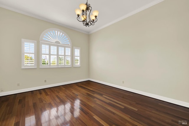 empty room featuring crown molding, baseboards, a chandelier, and dark wood finished floors