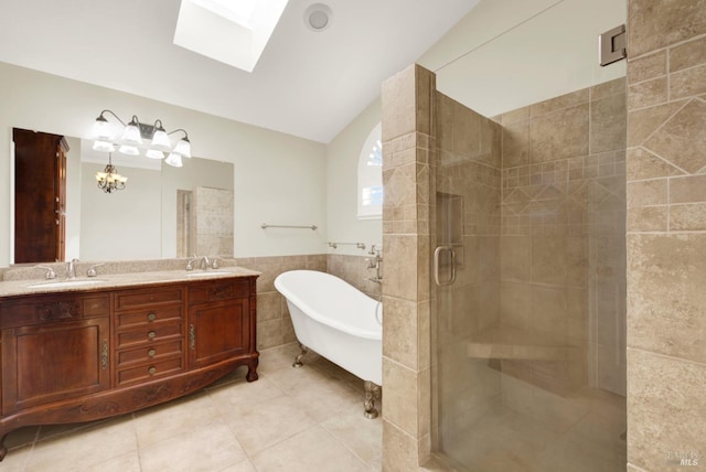 full bathroom with tile patterned flooring, tile walls, a soaking tub, a sink, and a stall shower