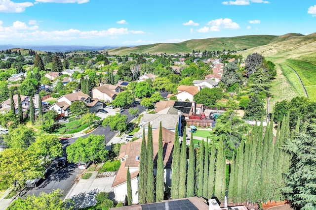 drone / aerial view featuring a residential view and a mountain view