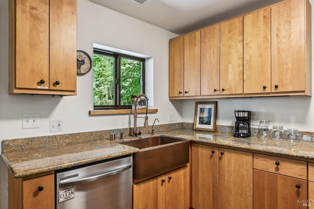 kitchen featuring a sink, dishwasher, brown cabinets, and light stone countertops
