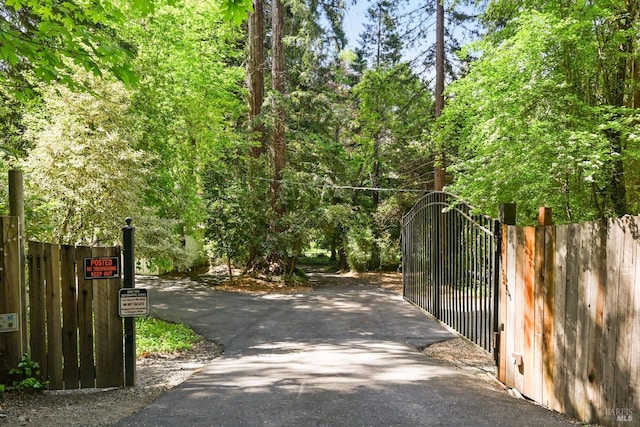 view of gate with fence