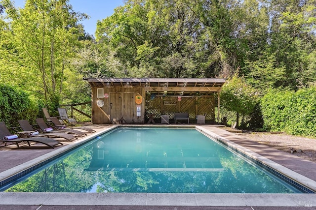 community pool with a patio area