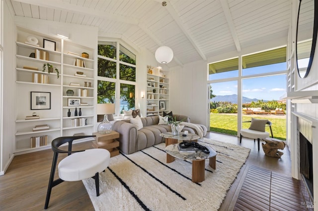 interior space featuring beamed ceiling and a mountain view