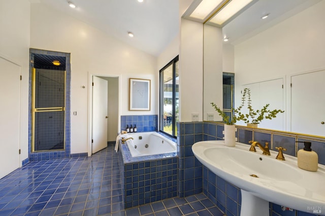 bathroom with a tub with jets, a stall shower, high vaulted ceiling, and tile patterned floors