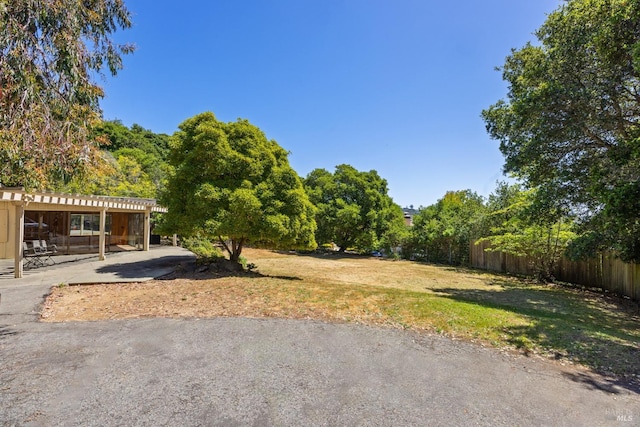 view of yard with a patio and fence
