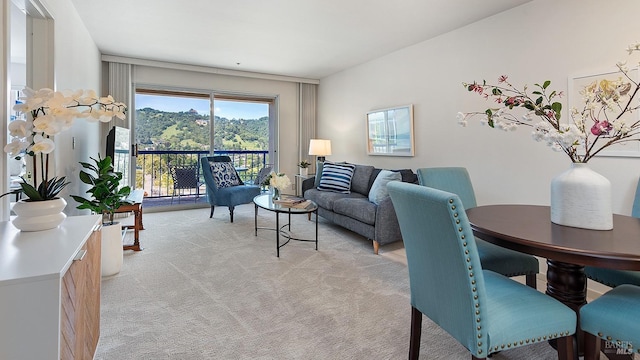 living room featuring light carpet