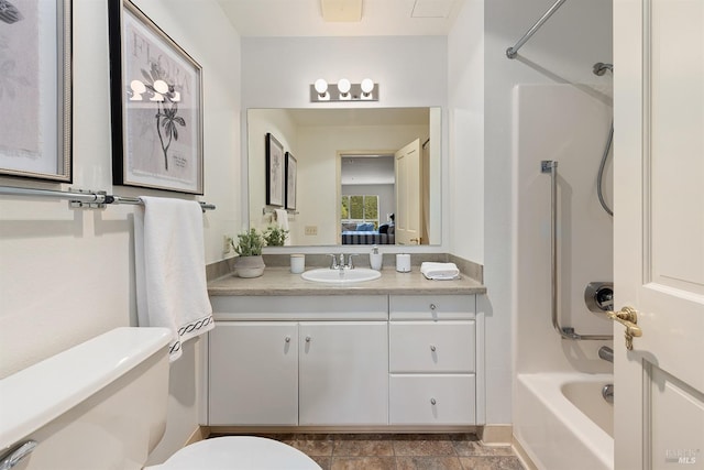 bathroom featuring toilet, washtub / shower combination, and vanity