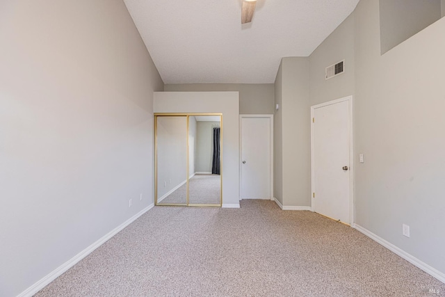 unfurnished bedroom featuring a closet, baseboards, carpet flooring, and visible vents