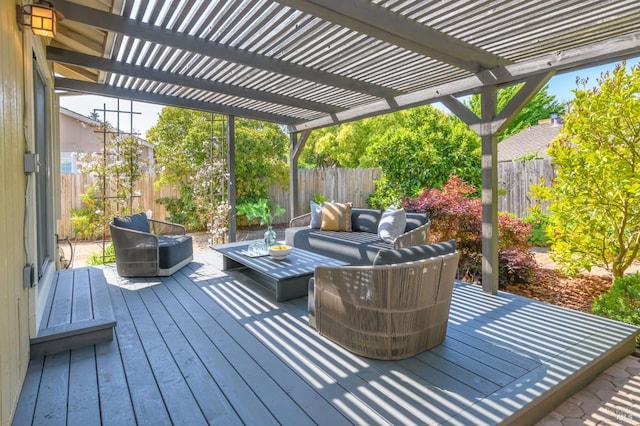 wooden deck with a pergola, outdoor lounge area, and a fenced backyard