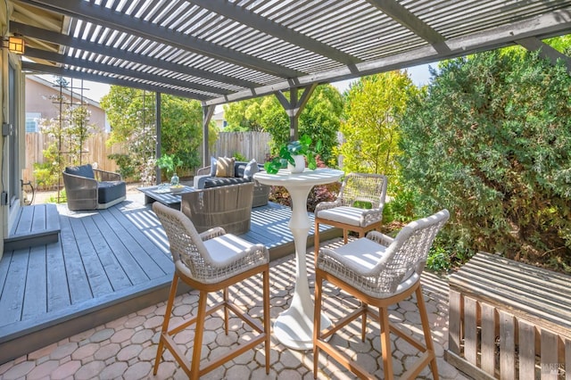 deck with a pergola and fence