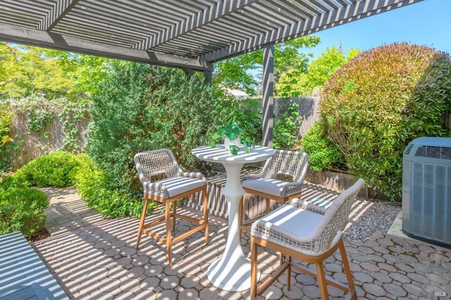 view of patio / terrace with a fenced backyard, a pergola, and cooling unit