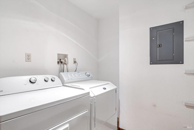 laundry area with electric panel, laundry area, and washing machine and dryer
