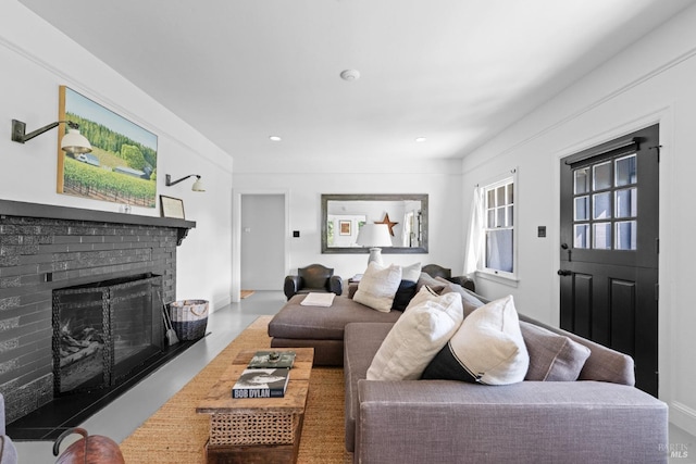 living area featuring a fireplace and recessed lighting