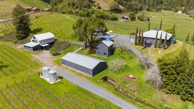 birds eye view of property featuring a rural view