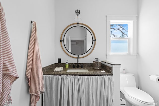bathroom with vanity and toilet