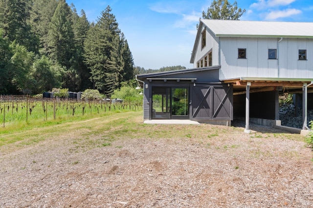 rear view of property with a carport