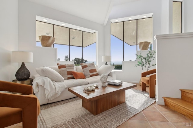 living room featuring baseboards and tile patterned floors