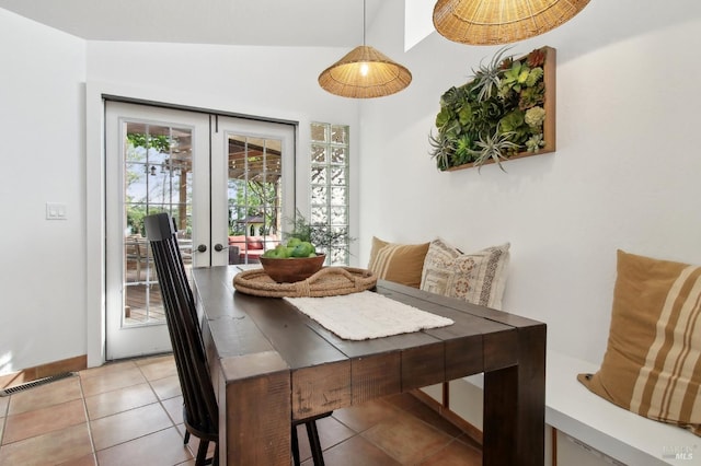 dining area featuring french doors, visible vents, and light tile patterned floors