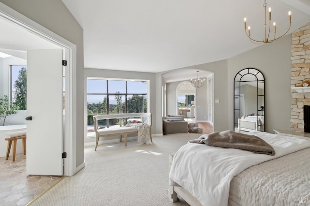 bedroom with baseboards, a fireplace, and a chandelier