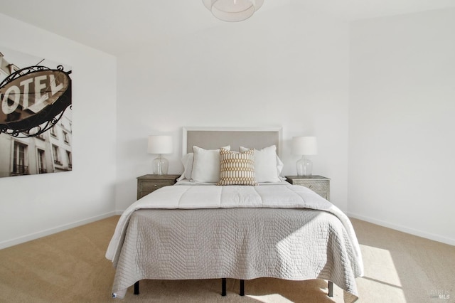 carpeted bedroom with baseboards