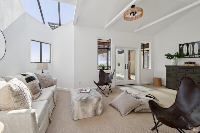 living room featuring high vaulted ceiling, baseboards, and carpet floors